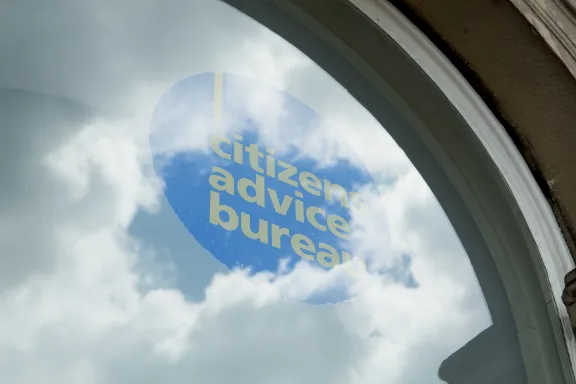 CAB logo in window with clouds